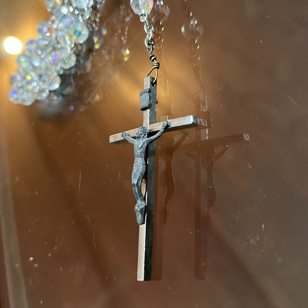 Rosary with clear beads (plastic) chain is metal and crucifix is pewter on steel